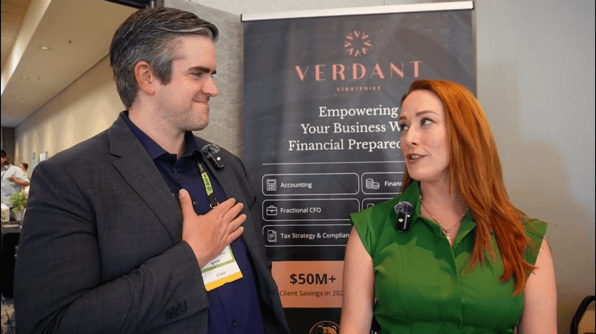 Luna Stower and Elliot Lane talk at the IgniteIt California Market Spotlight in June 2025, standing in front of a Verdant Strategies banner promoting financial preparedness.